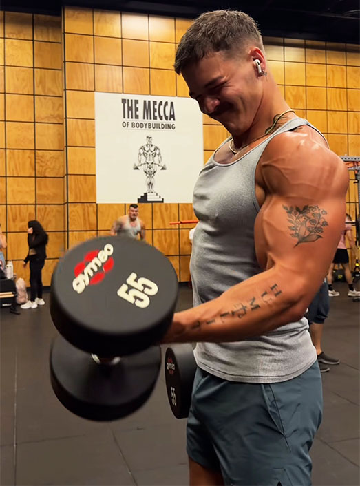 Coach is lifting a weight.